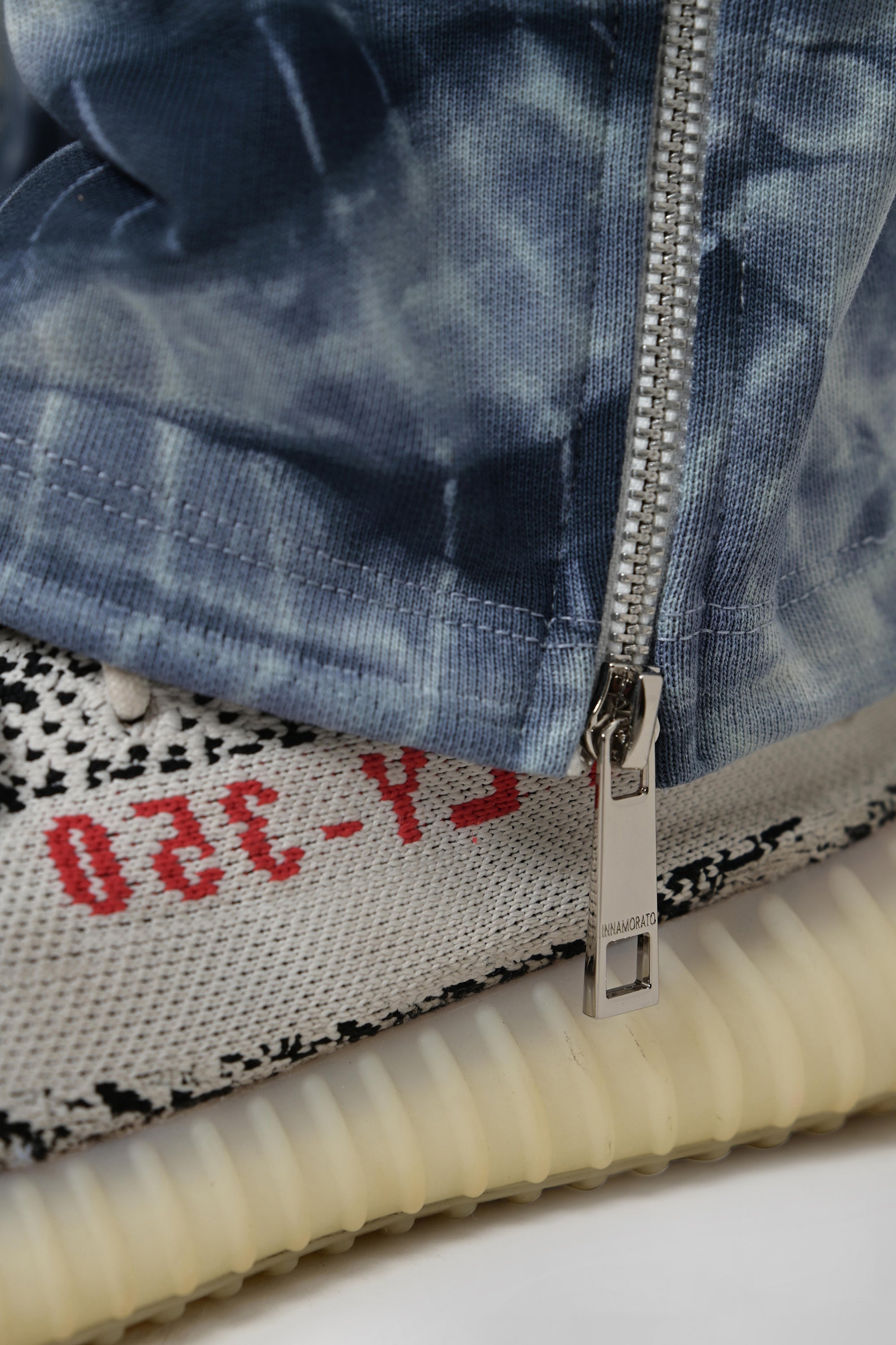 Tie & dye cargo pants with rubberized logo patch from innamoratoclo.com