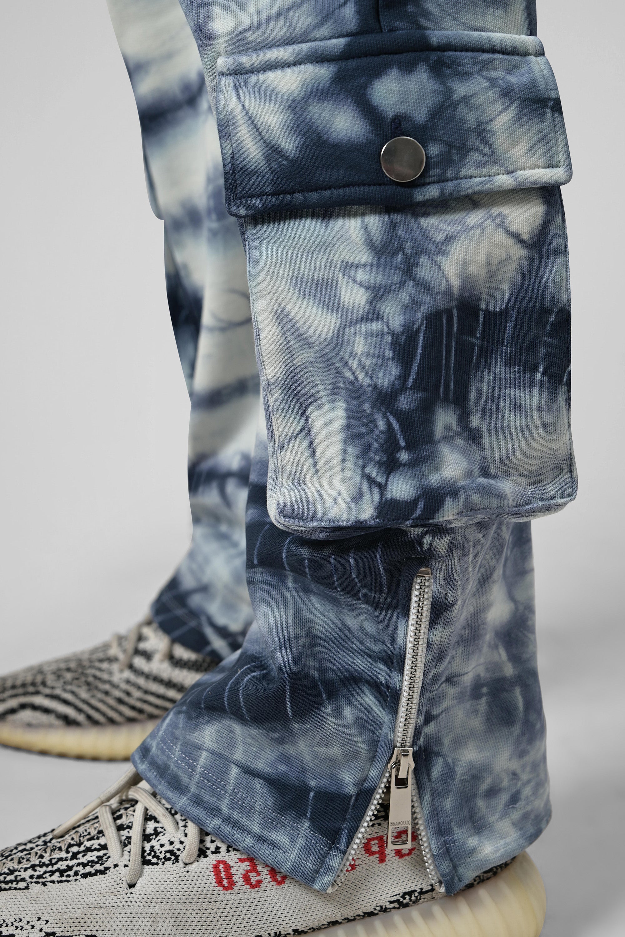 Tie & dye cargo pants with rubberized logo patch from innamoratoclo.com